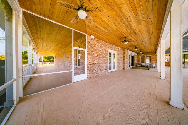 exterior space with french doors and a ceiling fan