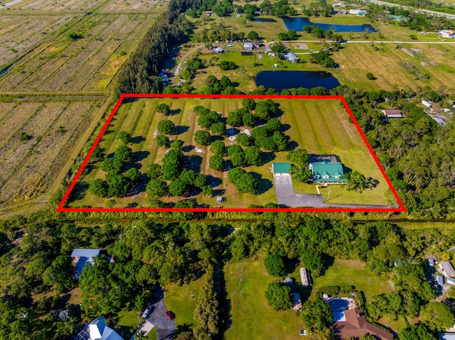 8686 Andrews Ave, Fort Pierce, FL 34945 - view of rural area with a large body of water, property boundaries highlighted, and abundant farmland