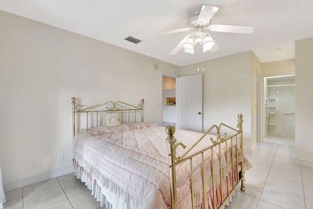 bedroom with light tile patterned flooring, visible vents, a ceiling fan, and baseboards