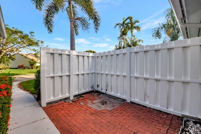 view of patio featuring fence