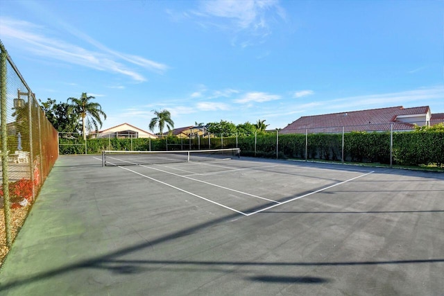 view of tennis court with fence