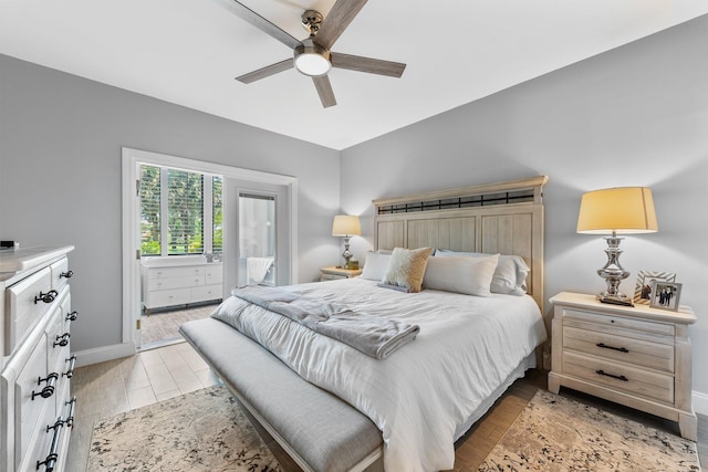 bedroom with baseboards, light wood-style floors, and ceiling fan