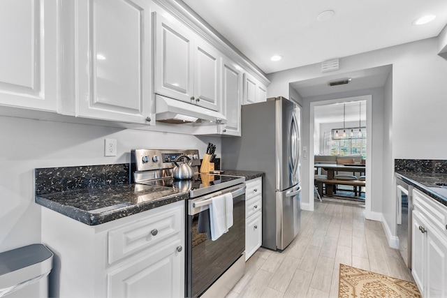 kitchen featuring under cabinet range hood, recessed lighting, light wood-style flooring, appliances with stainless steel finishes, and white cabinetry