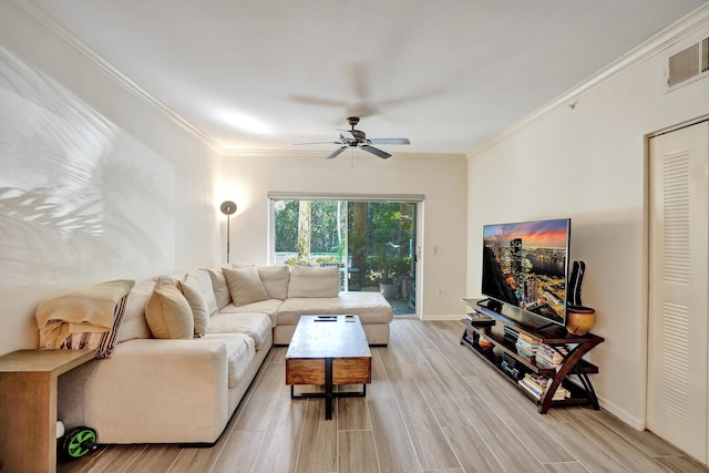 living room featuring wood finish floors, a ceiling fan, visible vents, and ornamental molding