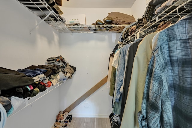 spacious closet featuring wood finished floors