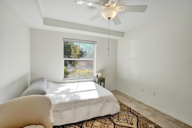 bedroom with baseboards and ceiling fan