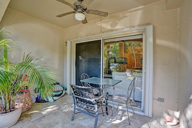 view of patio / terrace with outdoor dining area and a ceiling fan