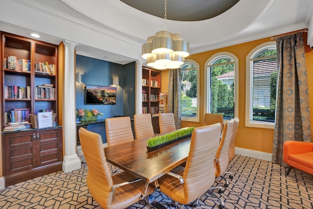 dining area with ornate columns, baseboards, crown molding, and a tray ceiling