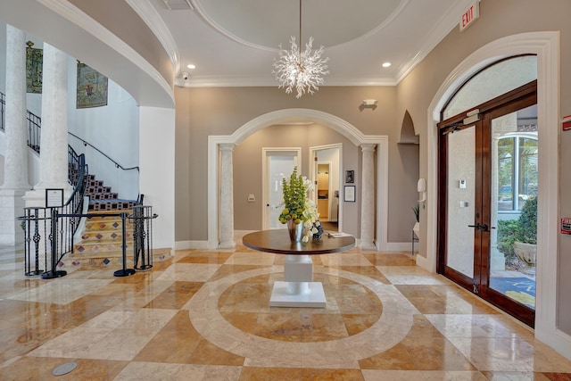 entryway featuring recessed lighting, baseboards, a notable chandelier, and crown molding