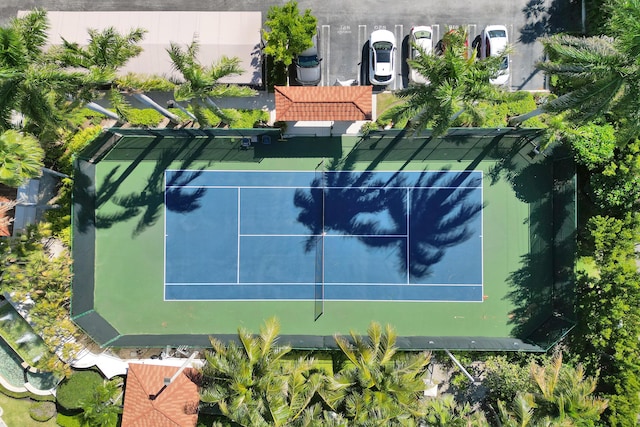 view of sport court featuring fence