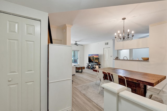 dining space with visible vents, a ceiling fan, and light wood-style floors