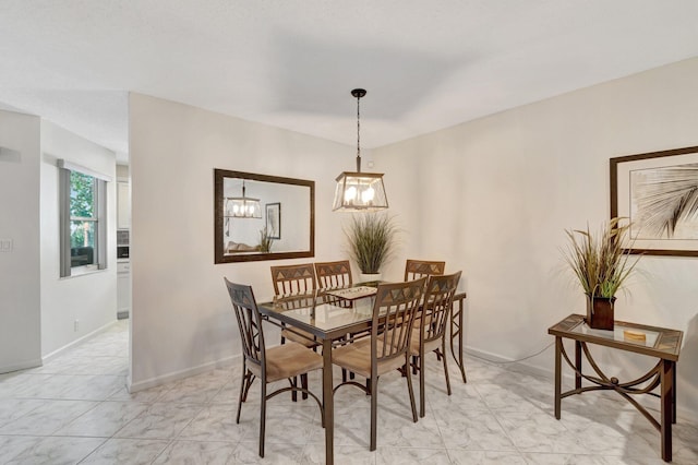 dining space featuring baseboards