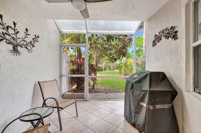 sunroom with a ceiling fan