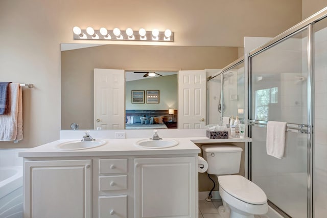 ensuite bathroom with double vanity, a stall shower, ensuite bathroom, and a sink