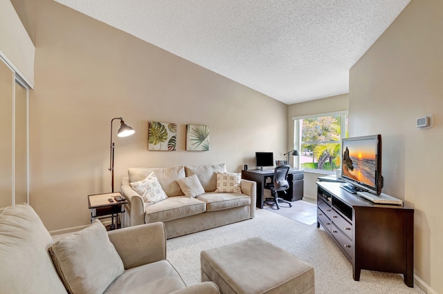 living area with baseboards, light colored carpet, a textured ceiling, and lofted ceiling