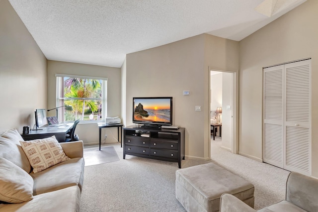 living room featuring carpet flooring, baseboards, and a textured ceiling