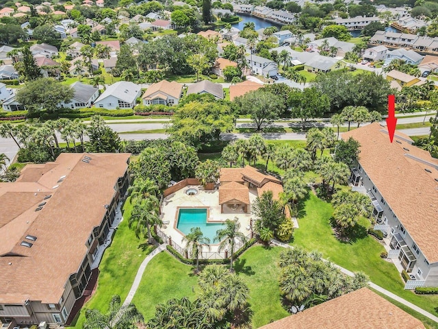 drone / aerial view with a residential view and a water view