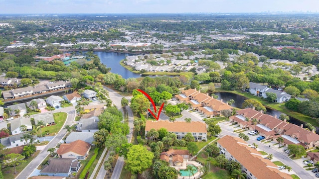 birds eye view of property featuring a residential view and a water view