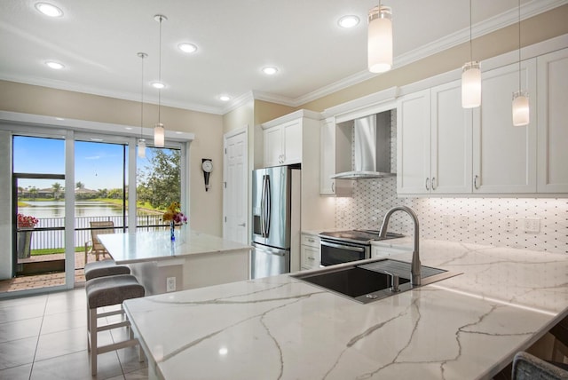 kitchen featuring a sink, tasteful backsplash, stainless steel appliances, crown molding, and wall chimney range hood