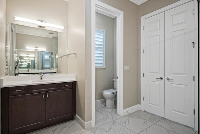 bathroom with baseboards, toilet, marble finish floor, and vanity