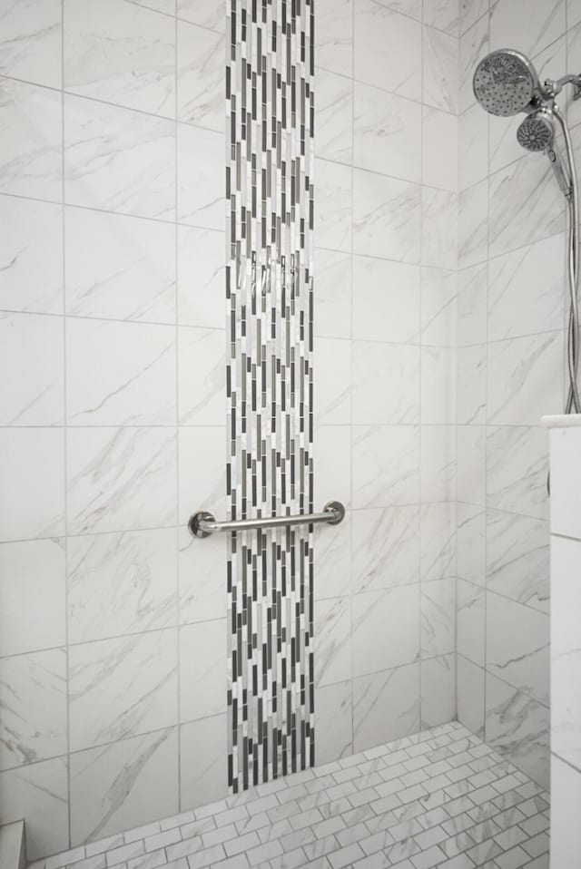 bathroom with a tile shower