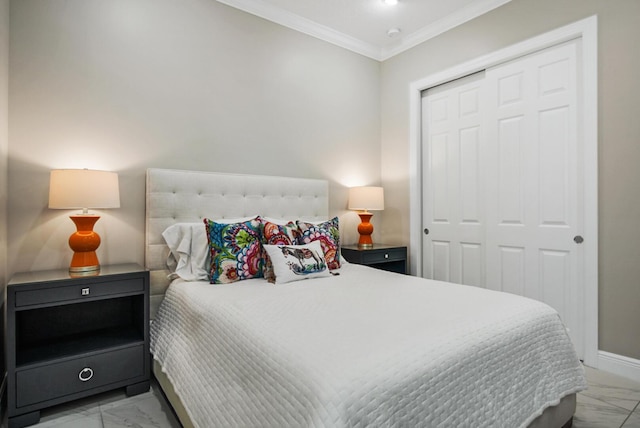 bedroom with a closet, marble finish floor, baseboards, and ornamental molding