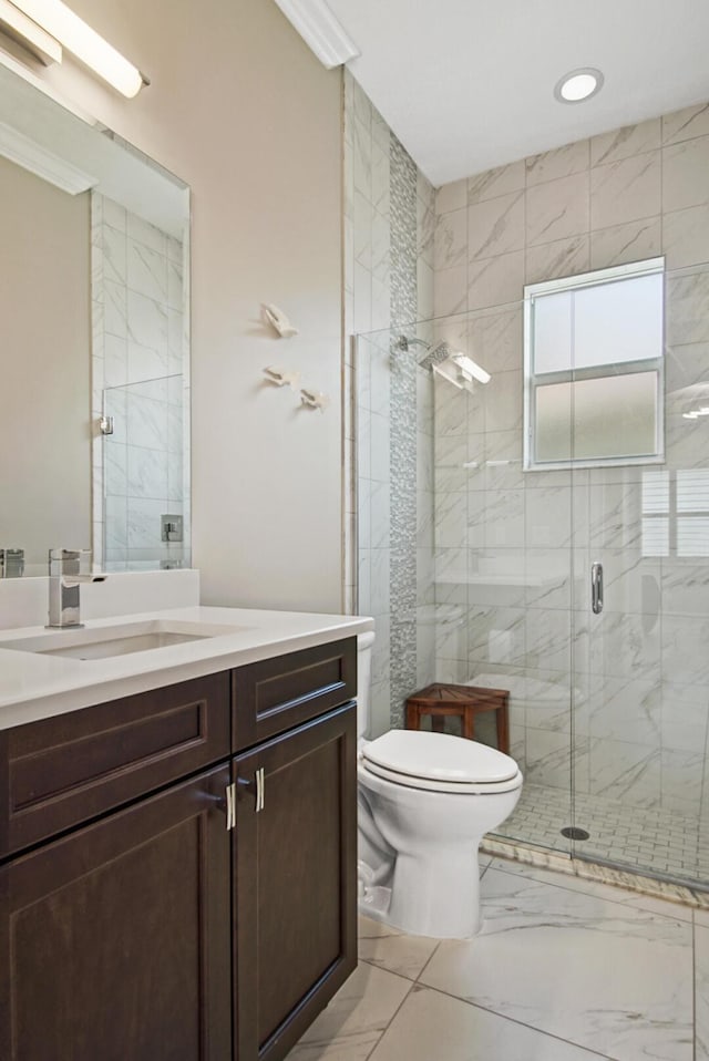 bathroom featuring vanity, recessed lighting, a shower stall, toilet, and marble finish floor