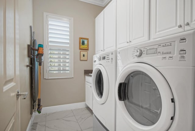 laundry area with washer and dryer, baseboards, cabinet space, and marble finish floor