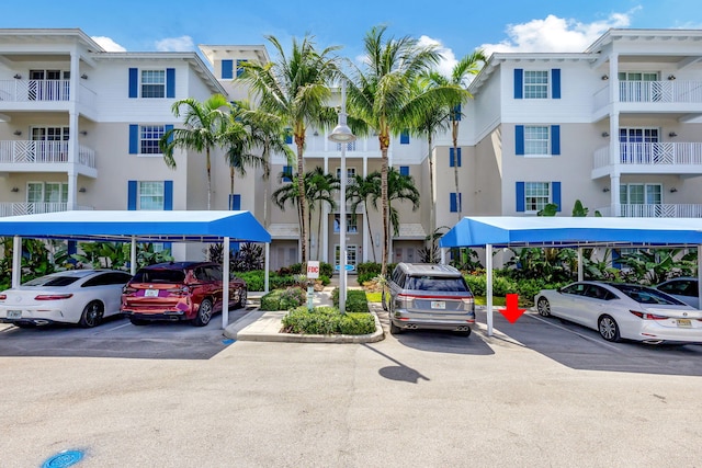 view of property featuring covered parking