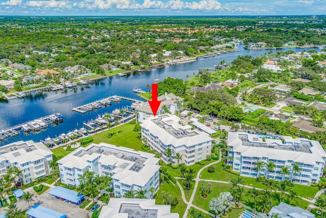 birds eye view of property with a water view