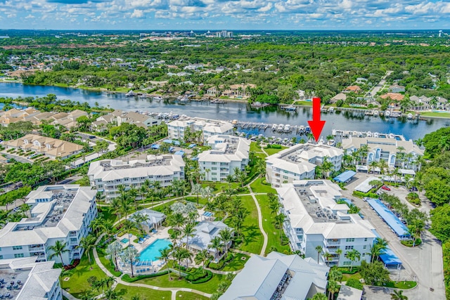 birds eye view of property with a residential view and a water view