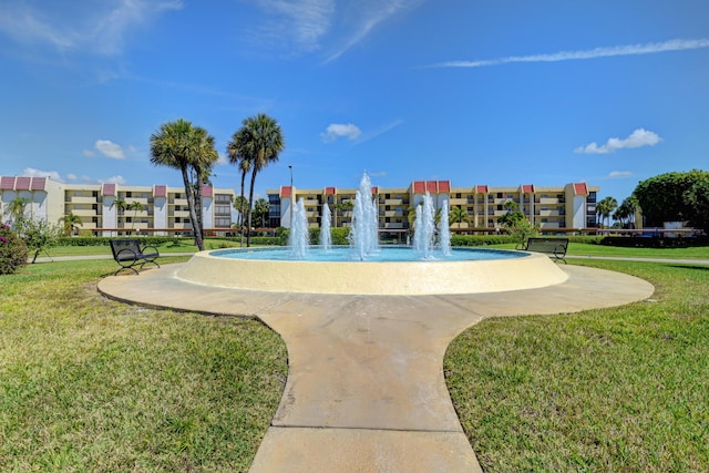 view of property's community featuring a yard