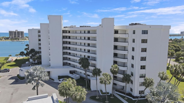 view of building exterior featuring a view of city and a water view