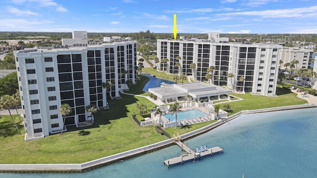 birds eye view of property with a water view