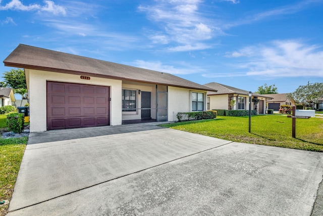 single story home with stucco siding, driveway, a garage, and a front yard