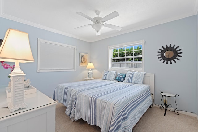 bedroom featuring light colored carpet, ceiling fan, and crown molding