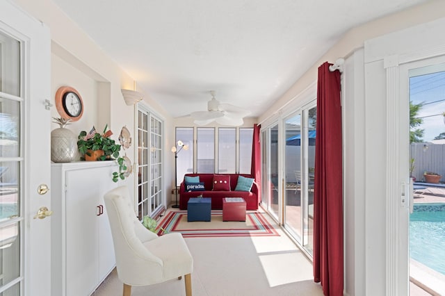 sunroom with french doors and ceiling fan