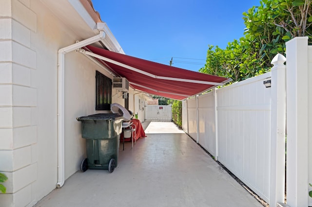 view of patio / terrace featuring a carport and fence