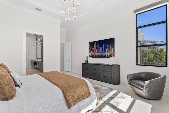 bedroom with visible vents, connected bathroom, baseboards, a high ceiling, and a raised ceiling