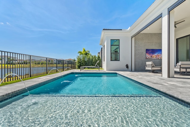 view of swimming pool with a fenced in pool, a patio, a water view, and fence