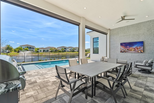 view of patio with a fenced in pool, area for grilling, outdoor dining area, a fenced backyard, and a residential view