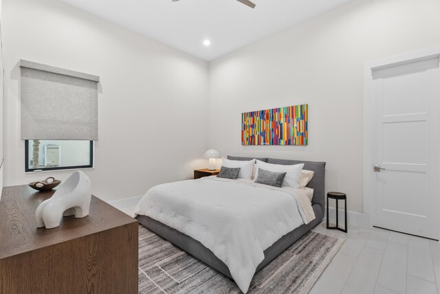 bedroom with a ceiling fan, recessed lighting, and baseboards