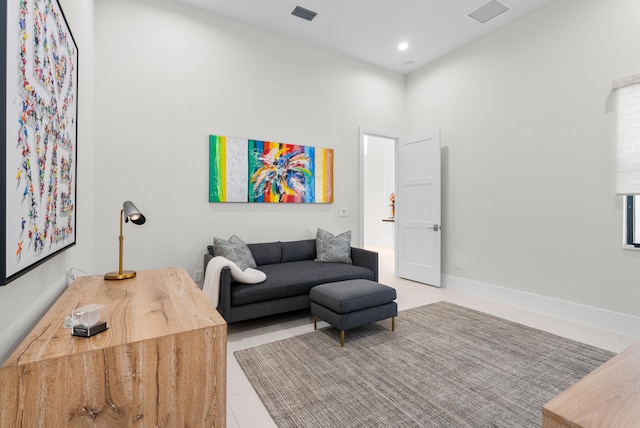 living room with tile patterned flooring, visible vents, recessed lighting, and baseboards