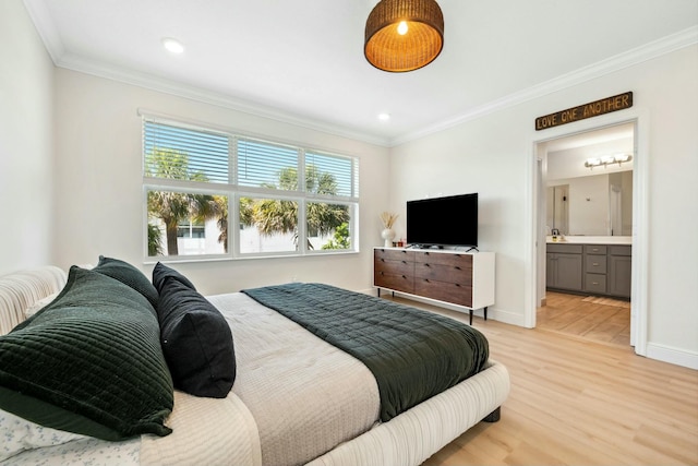 bedroom with baseboards, light wood finished floors, ensuite bath, recessed lighting, and crown molding