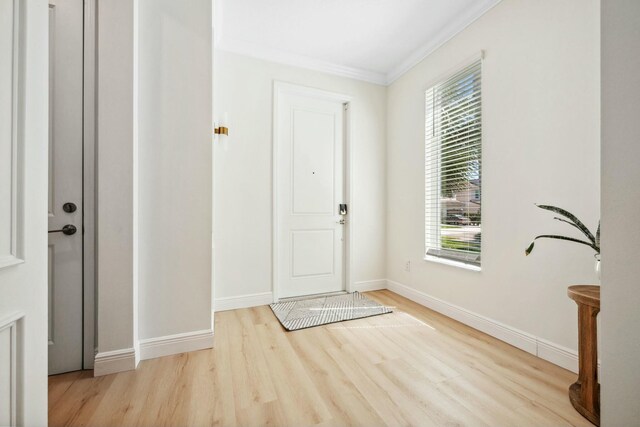 4347 Veleiros Ave, Deerfield Beach, FL 33064 - entryway with baseboards, wood finished floors, and crown molding