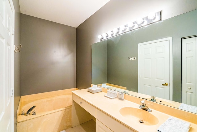 bathroom featuring vanity and a garden tub