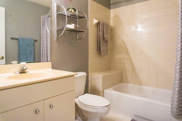 full bath featuring vanity, tile patterned floors, toilet, and shower / bath combo