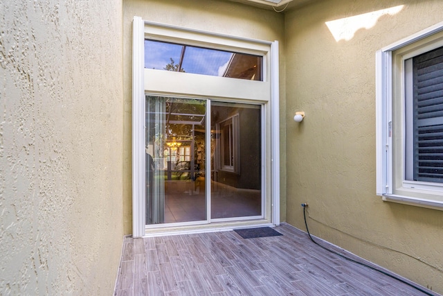 entrance to property with stucco siding