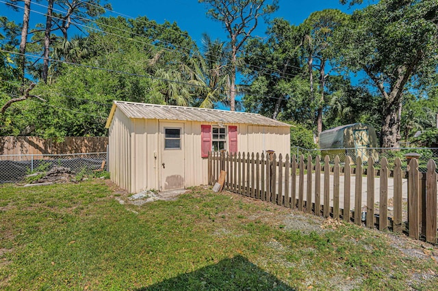 view of shed featuring a fenced backyard