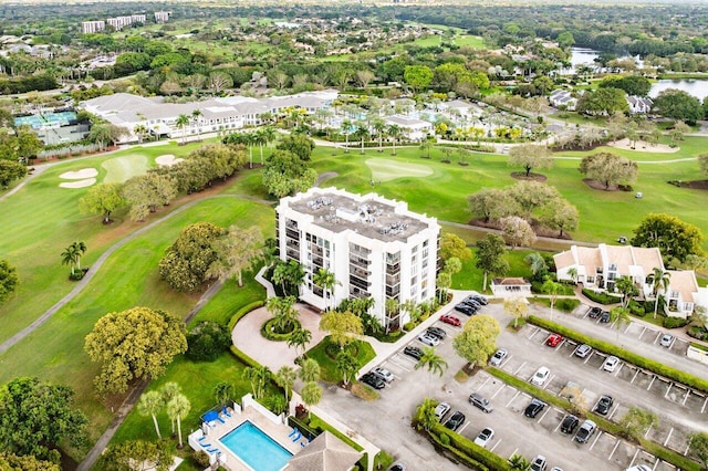 birds eye view of property with view of golf course